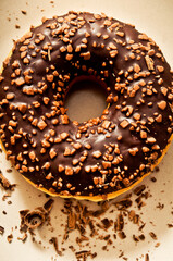 a dougnut or donut with chocolate topping glaze  from above look