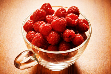 glass cup of summer fruit raspberries , fresh raspberry