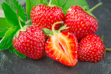 Strawberry ripe berry on an old background.