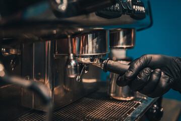 Barista hand making cappuccino Coffee with espresso machine in cafe