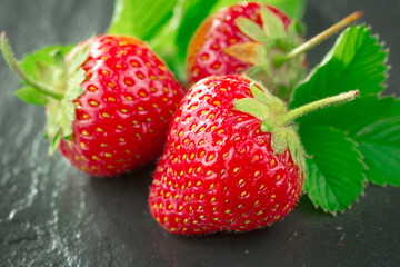 Strawberry ripe berry on an old background.