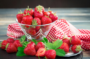 Sweet strawberry and healthy, wholesome food in composition on the table.