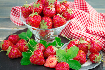 Sweet strawberry and healthy, wholesome food in composition on the table.