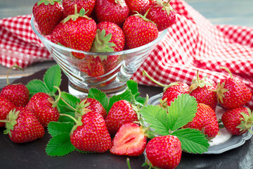 Sweet strawberry and healthy, wholesome food in composition on the table.