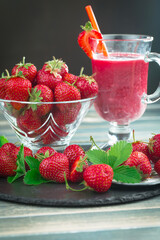 Sweet strawberry and healthy, wholesome food in composition on the table.