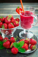 Sweet strawberry and healthy, wholesome food in composition on the table.