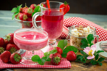 Sweet strawberry and healthy, wholesome food in composition on the table.