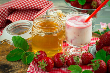 Sweet strawberry and healthy, wholesome food in composition on the table.