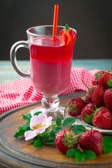 Sweet strawberry and healthy, wholesome food in composition on the table.