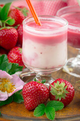 Sweet strawberry and healthy, wholesome food in composition on the table.