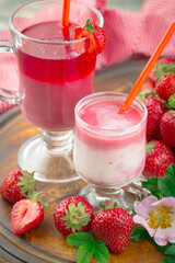 Fruit cocktail from fresh strawberries on the kitchen table.