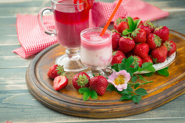 Sweet strawberry and healthy, wholesome food in composition on the table.