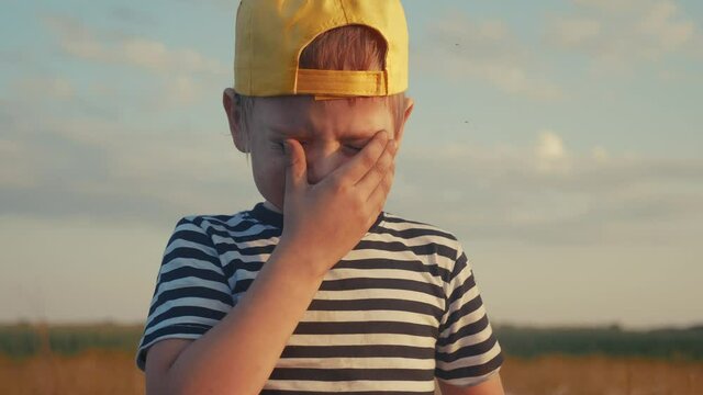 boy kid crying flowing tears a screaming dirty face. child son scream disappointed cranky. domestic violence concept. close-up toddler roared lifestyle all in tears