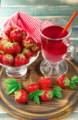 Sweet strawberry and healthy, wholesome food in composition on the table.