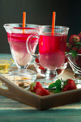Fruit cocktail from fresh strawberries on the kitchen table.