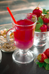 Fruit cocktail from fresh strawberries on the kitchen table.