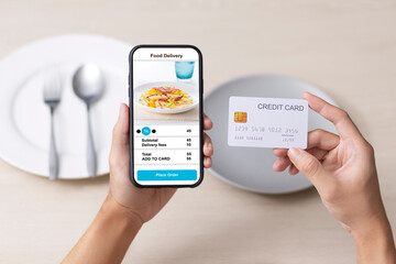 holding phone with application delivery food online