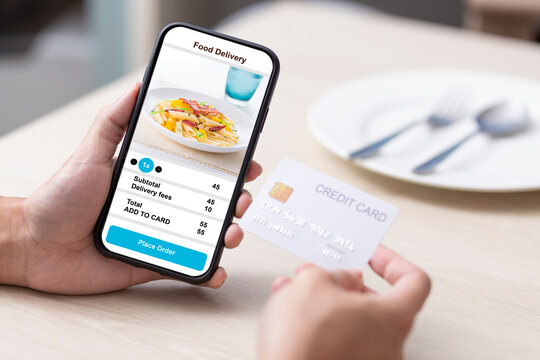 holding phone with application delivery food online