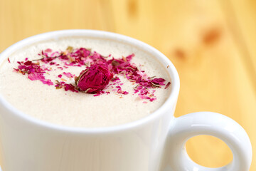 tasty cappuccono with rose petals