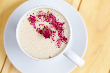 tasty cappuccono with rose petals