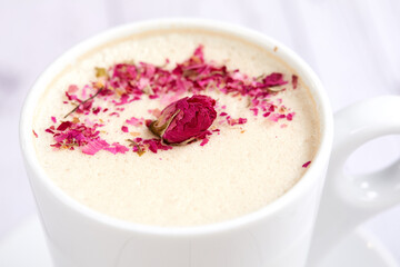 tasty cappuccono with rose petals