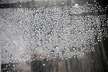 out of focus water drops in closeup creating bokeh background