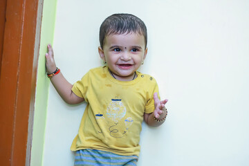 cute indian baby boy playing at home