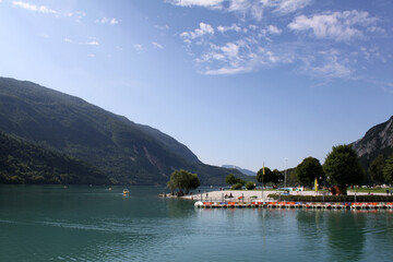 Molveno lake, port, beach and touristic life