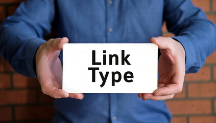 Link type seo - concept in the hands of a young man in a blue shirt