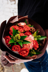 Bouquet of flowers in burgundy package