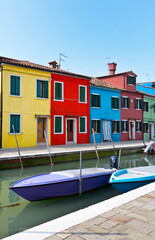 Fototapeta na wymiar Italy. Venice. Beautiful cityscape with boats on the canal and colorful houses typical of the island of Burano