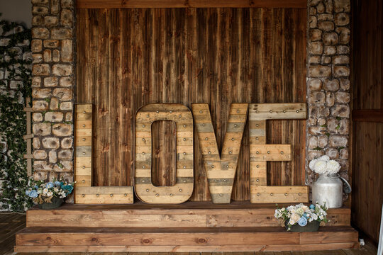Wood word love in a photo studio.