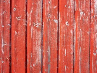 Weathered red boards in vertical pattern