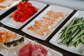 Ingredients for making sushi, arranged on plates. The view from the top