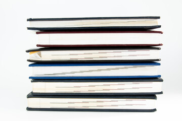 a stack of old books on a white background