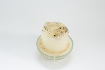 old white candle on a white background