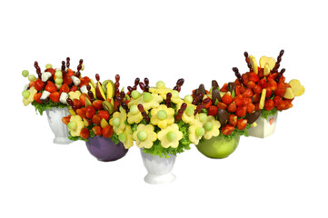Assorted colorful fruits arranged into a decorative bouquet