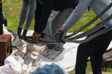 Workers are moving cables in construction sites.