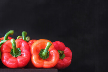Red peppers on a black background