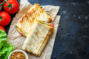 wrap tortilla or burrito stuffing vegetables vegetarian pita bread raw fish seafood in ice quick freeze Menu concept serving size. food background top view copy space for text organic healthy eating 