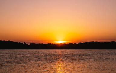 Naklejka na ściany i meble Summer sunset on a lake