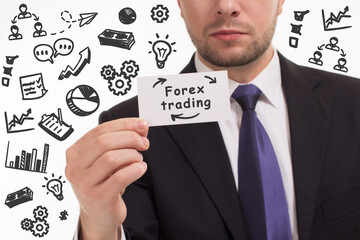 Business, technology, internet and network concept. Young businessman thinks over the steps for successful growth: Forex trading