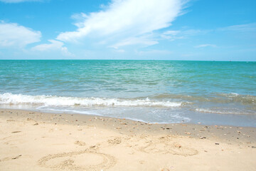 Beautiful tropical beach sand and sea with blue sky background at Hua-Hin District, Thailand