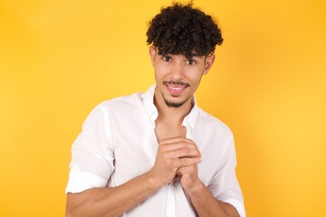 Handsome male half-length front portrait isolated on gray studio background. Young emotional surprised man standing with open mouth. Human emotions, facial expression concept. Trendy colors.