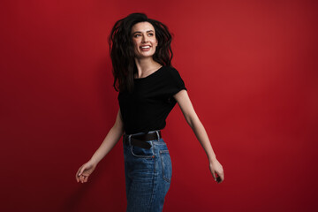 Photo of cheerful woman in casual t-shirt laughing and looking aside