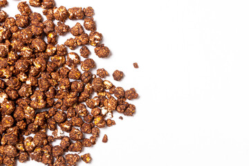 Sprinkled chocolate popcorn on a light background. Top view. Copy space.