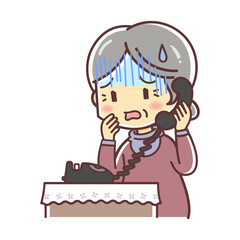 固定電話で話す高齢の女性（心配する）
