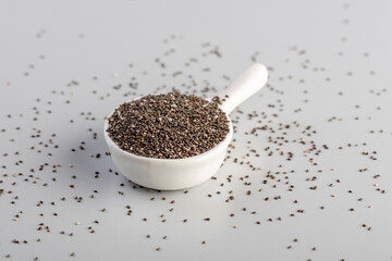 chia seeds in a small white bowl on cooking table