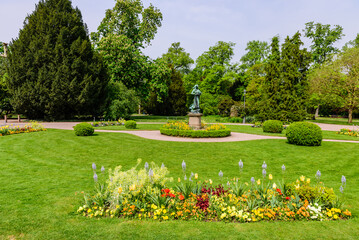 Green lawn with flowers in l'orangerie park - city Park in Strasbourg, France