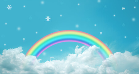 rainbow in cloudy sky with snowflakes